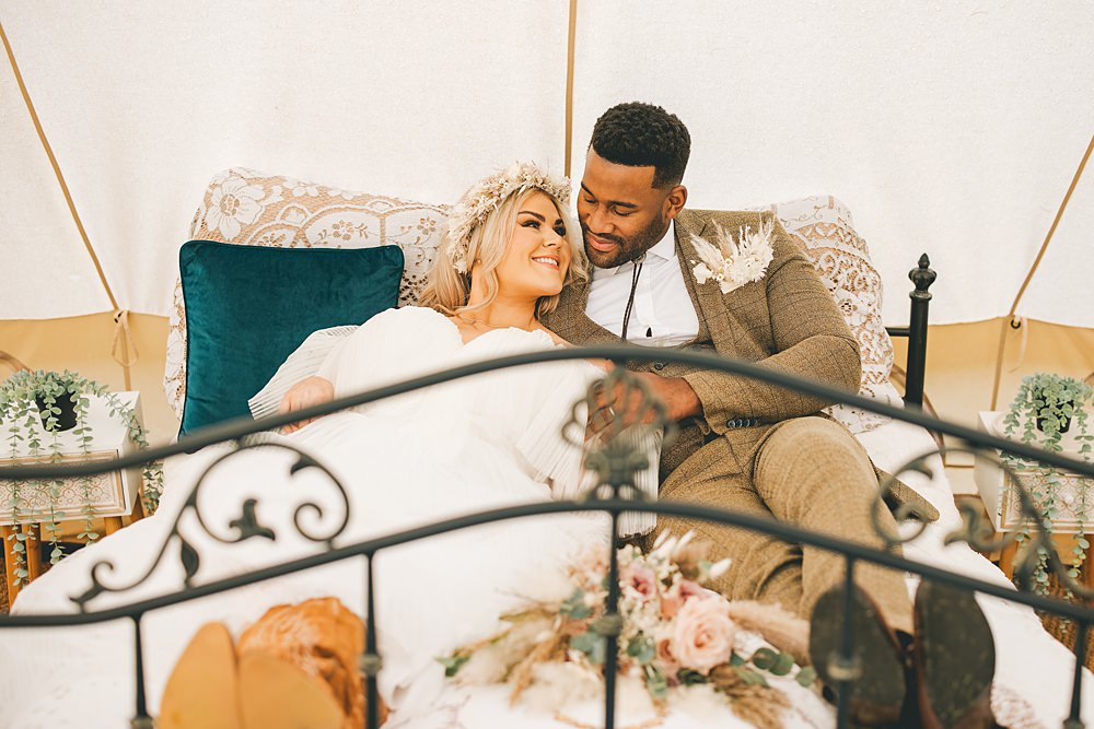 Boho Western Wedding Ideas Red Peacock Photography Bride Groom Bed