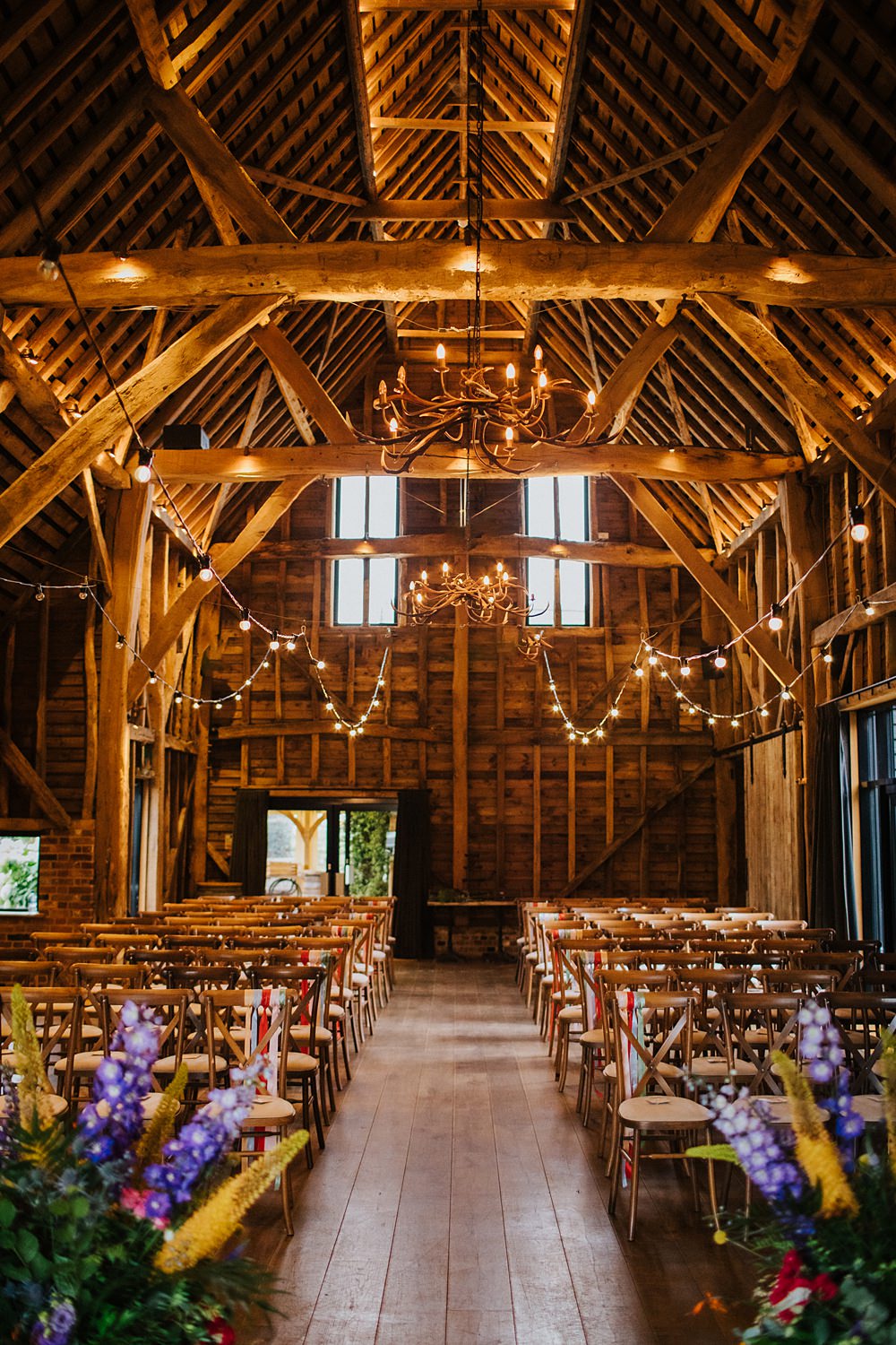 Colourful Hertfordshire Barn Wedding Binky Nixon Photography Festoon Lights Ceremony Decor