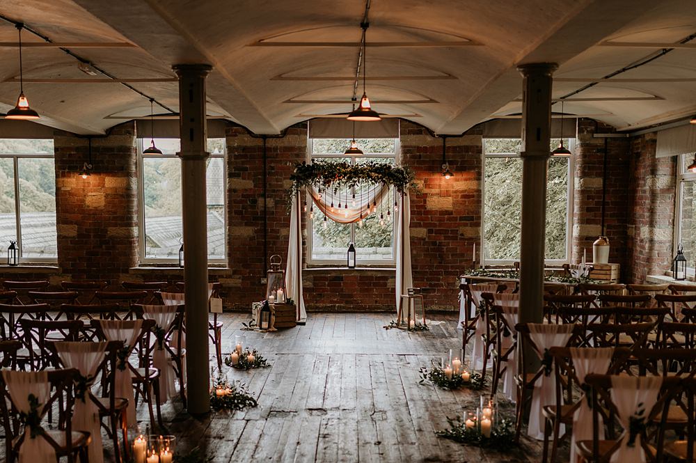 Cosy Romantic Wedding Hannah Shearman Photography Aisle Flowers Lanterns Candles Arch Backdrop