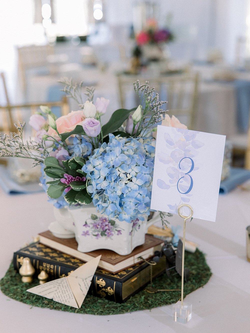 Mankin Mansion Wedding Willow Britt Studios Centrepiece Teapot Books Whimsical Decor Table Number