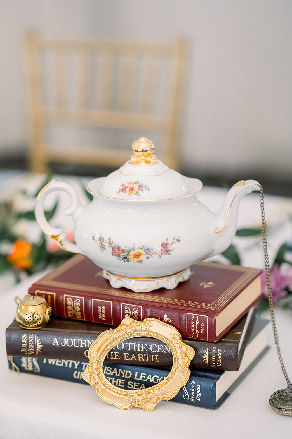 Mankin Mansion Wedding Willow Britt Studios Centrepiece Teapot Books Whimsical Decor