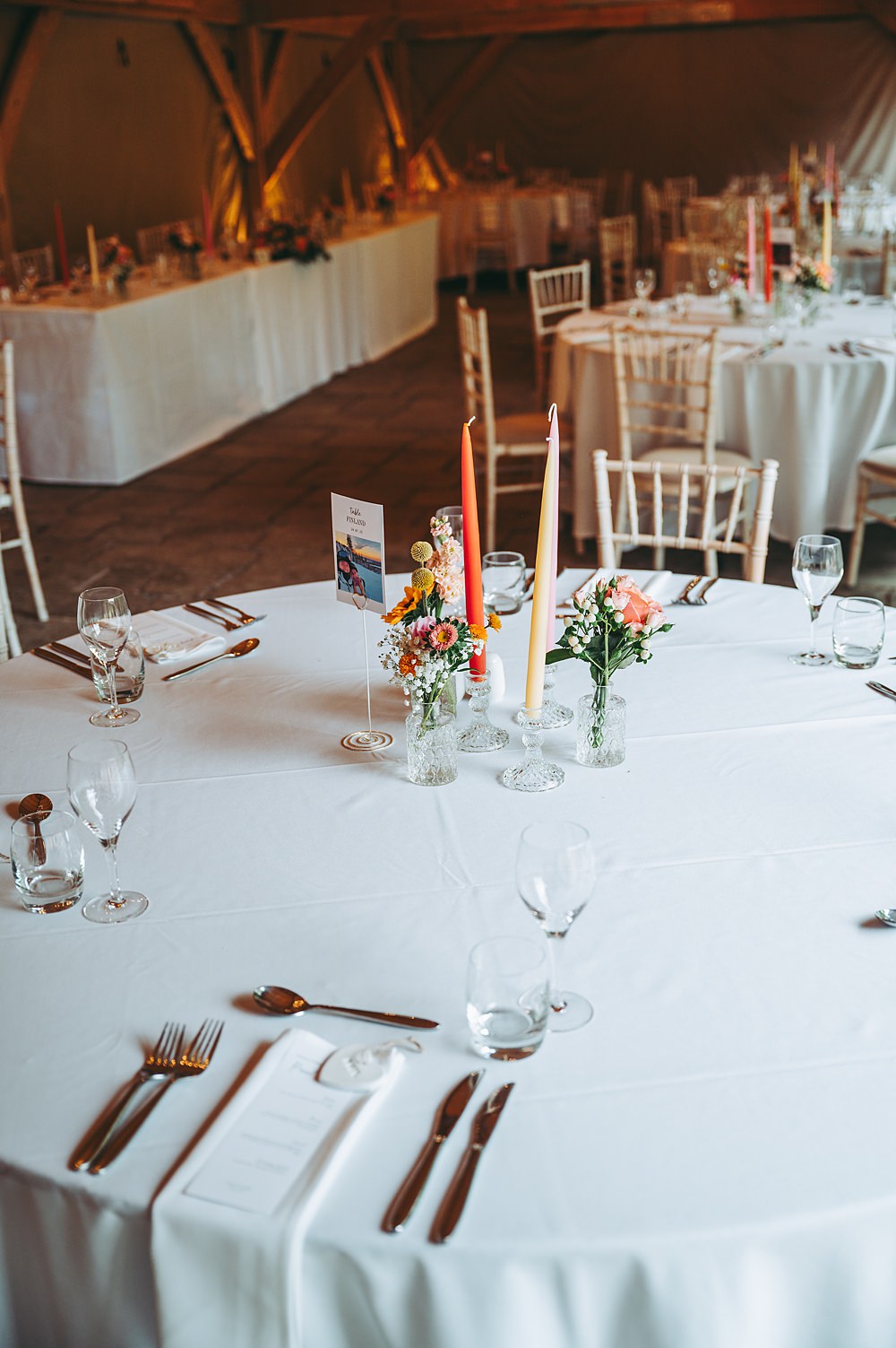 Manor House Wedding Cotswolds Cotswold Pictures Centrepiece Colourful Flowers Tall Candles Round Table