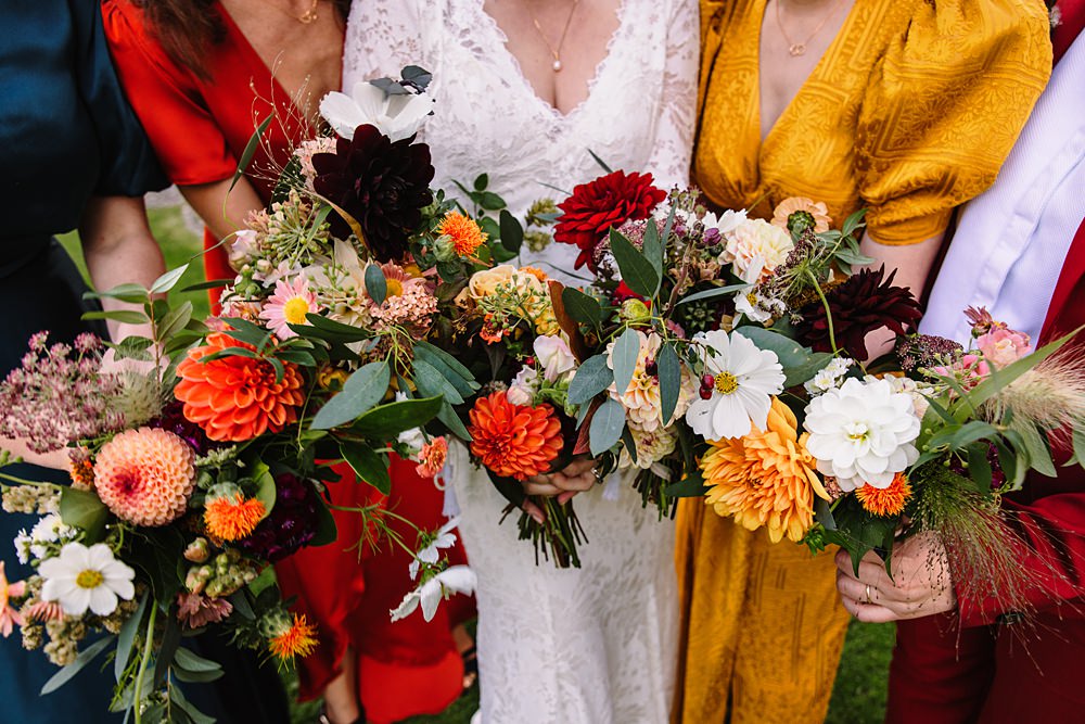 Shropshire Country House Wedding Kate Jackson Photography Bouquet Flowers Bride Red Yellow Greenery Bridesmaid