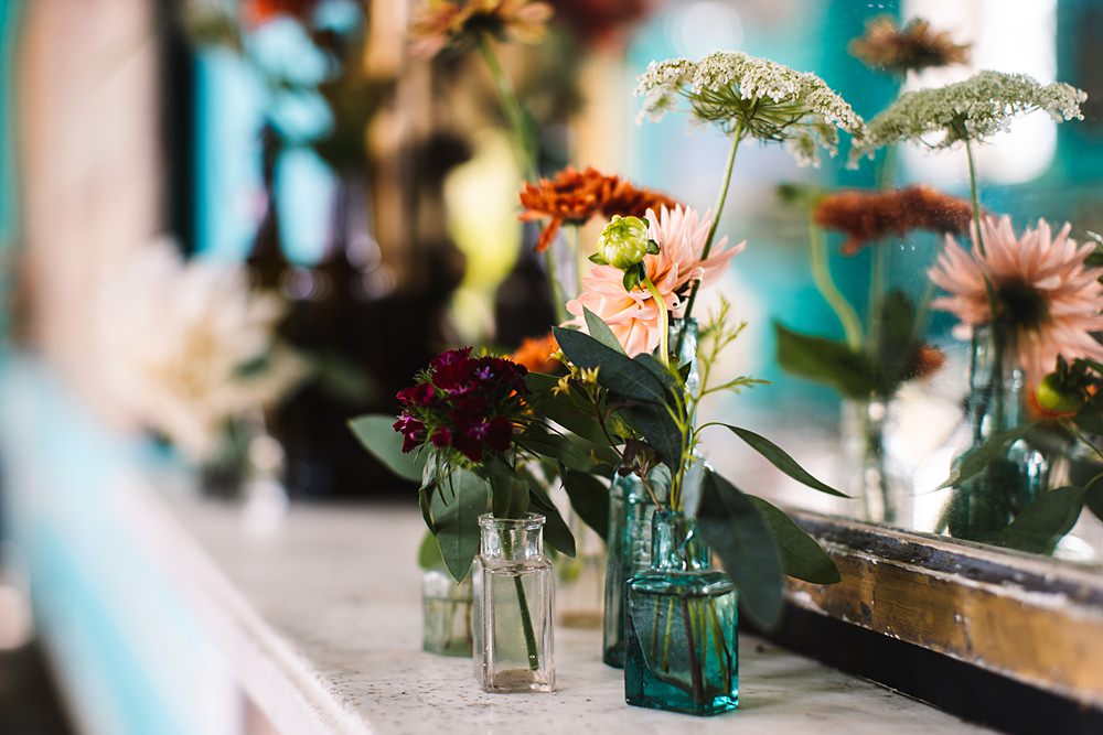 Shropshire Country House Wedding Kate Jackson Photography Bottle Flowers Mantlepiece