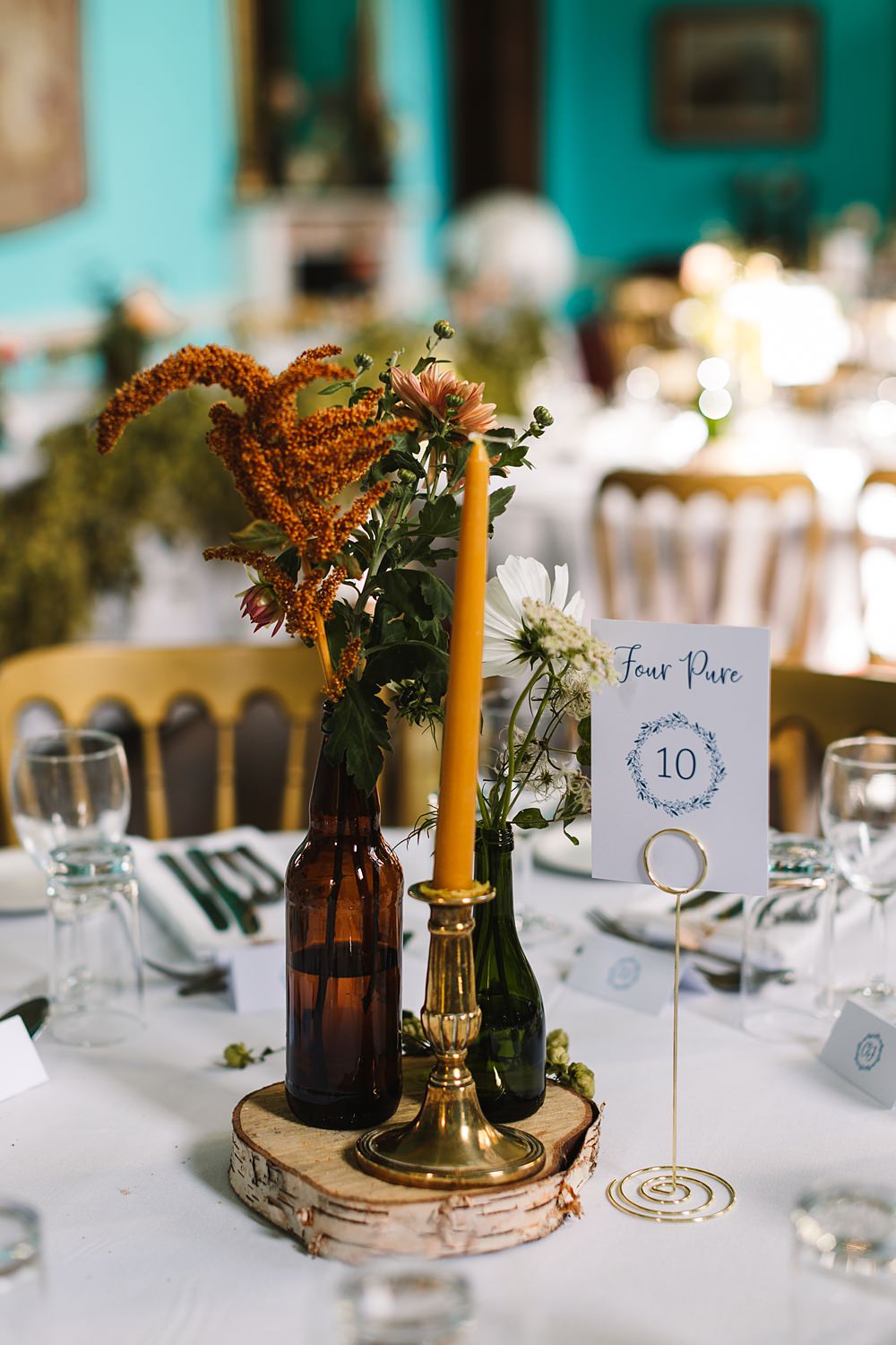 Shropshire Country House Wedding Kate Jackson Photography Centrepiece Log Slice Flowers Candles Colourful Table Number
