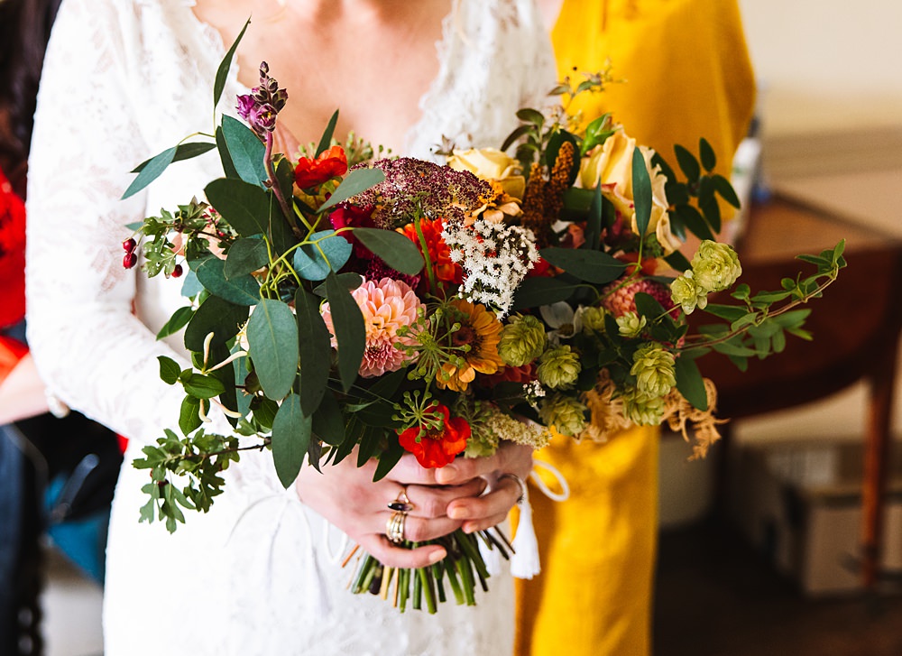 Shropshire Country House Wedding Kate Jackson Photography Bouquet Flowers Bride Red Yellow Greenery