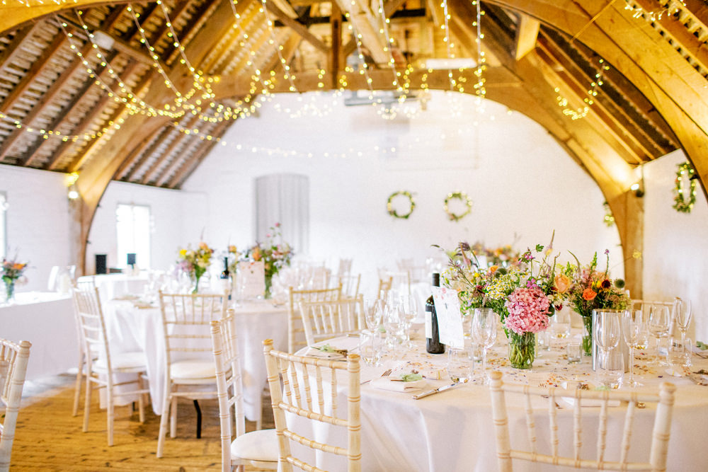 South Stoke Barn Wedding Gemma Vaughan Photography Barn Fairy Lights Circle Tables Flowers Centrepiece