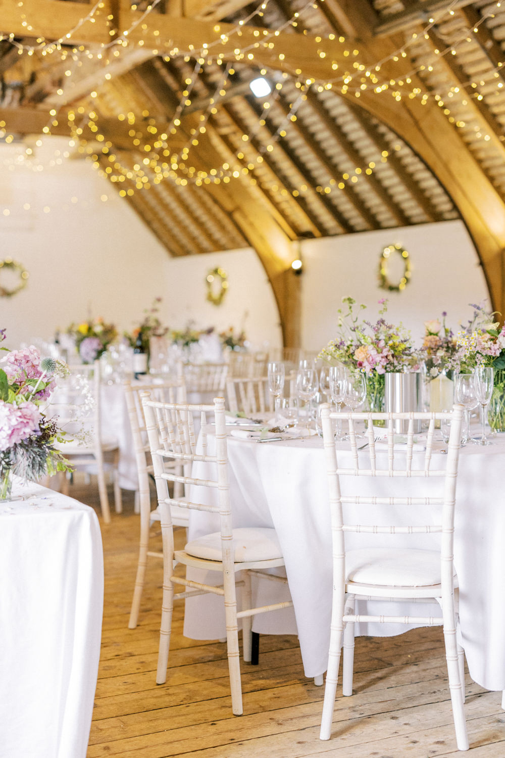 South Stoke Barn Wedding Gemma Vaughan Photography Barn Fairy Lights Circle Tables Flowers Centrepiece
