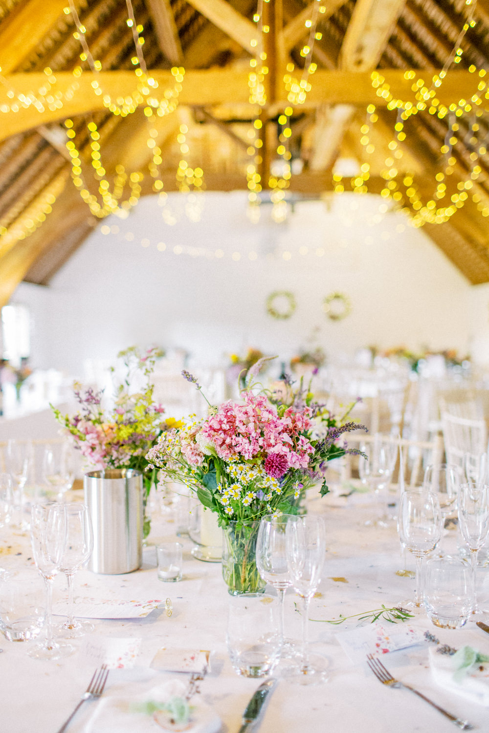 South Stoke Barn Wedding Gemma Vaughan Photography Barn Fairy Lights Circle Tables Flowers Centrepiece