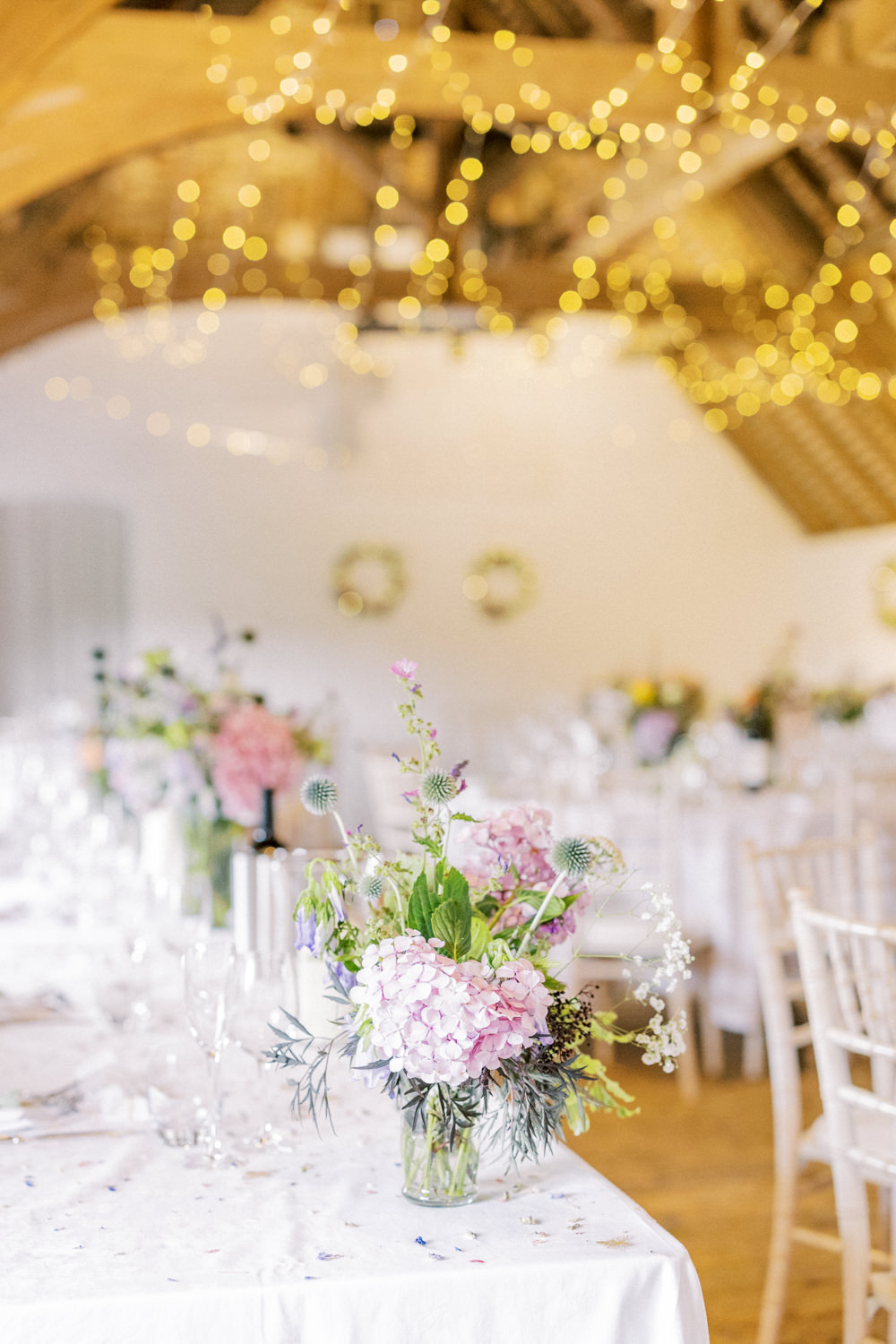 South Stoke Barn Wedding Gemma Vaughan Photography Barn Fairy Lights Circle Tables Flowers Centrepiece
