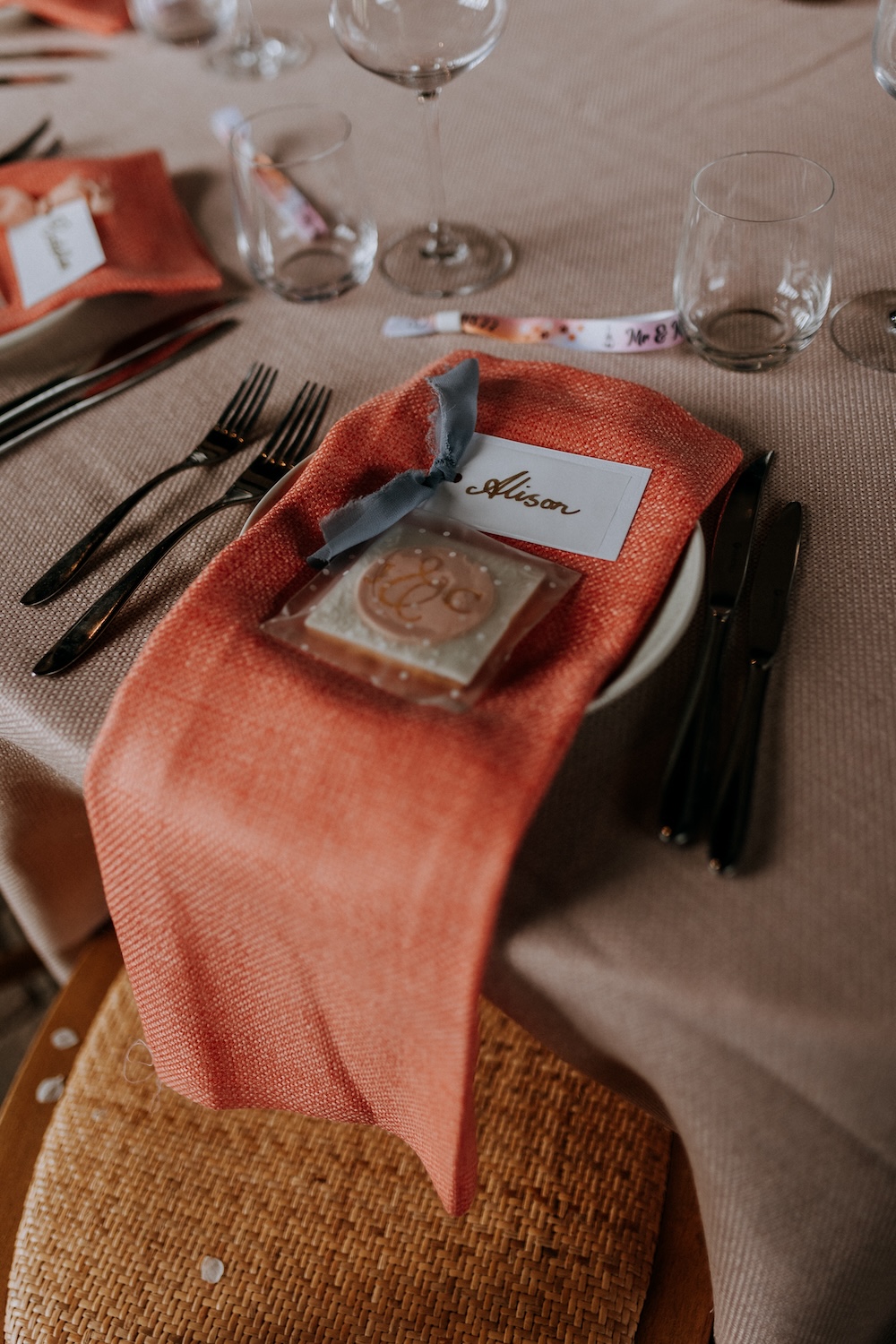 Elmley Nature Reserve Wedding Chris Blackledge Photography Orange Peach Napkin Place Setting Calligraphy Place Name Biscuit Favour