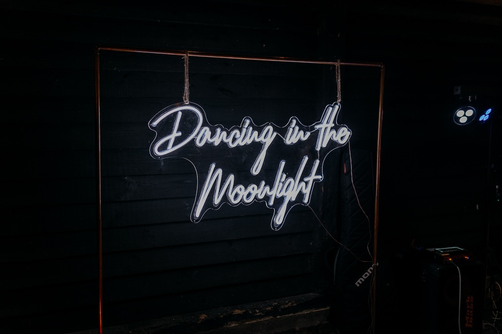 Elmley Nature Reserve Wedding Chris Blackledge Photography Neon Sign Backdrop