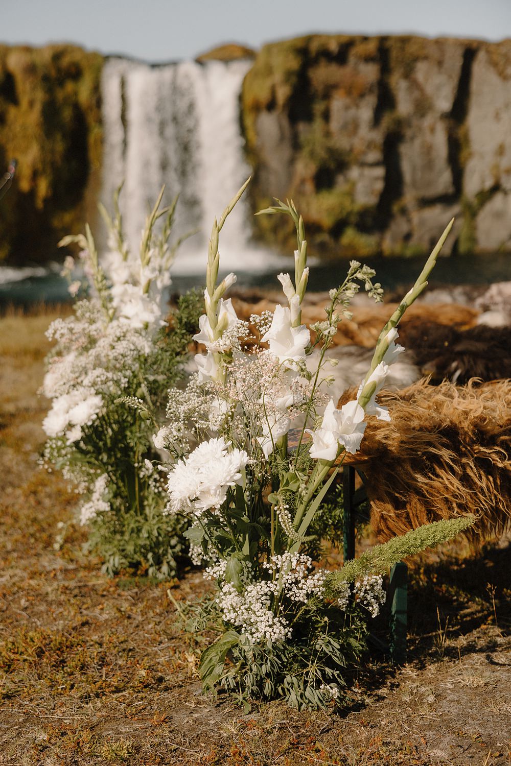 Hotel Katla Wedding ISKRA Photography Waterfall Ceremony Flower Aisle Greenery White