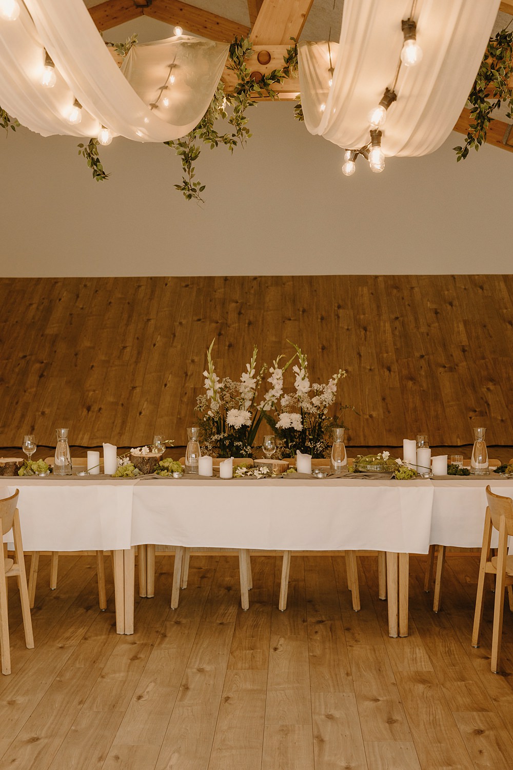 Hotel Katla Wedding ISKRA Photography Top Table Decor Greenery Flowers White Lights