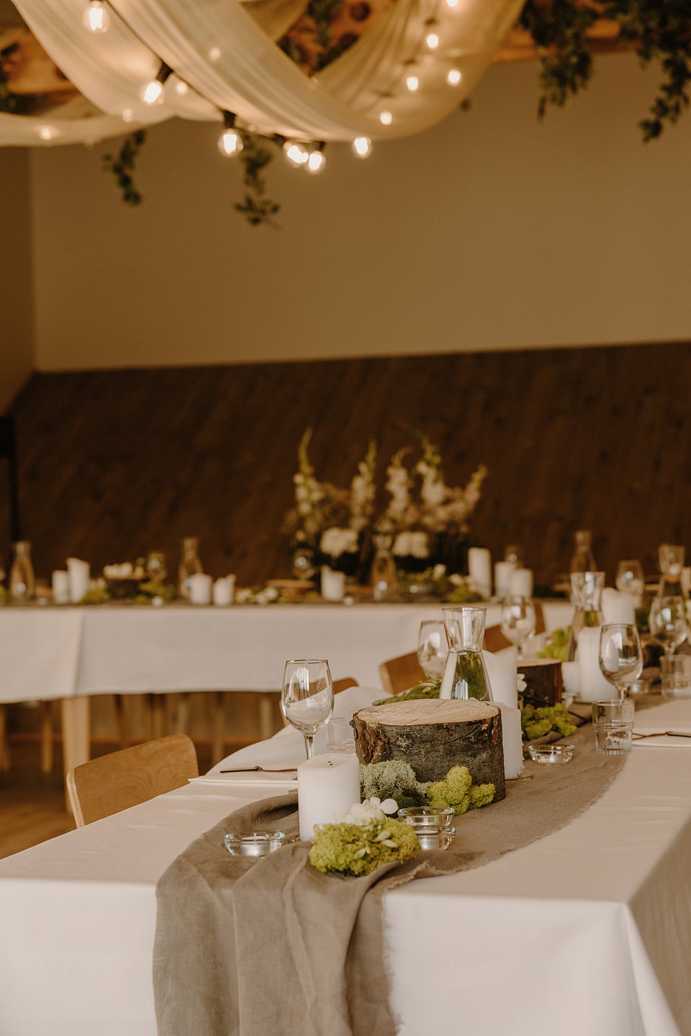 Hotel Katla Wedding ISKRA Photography Table Runner Burlap Hessian Log Slice Greenery Candles Moss
