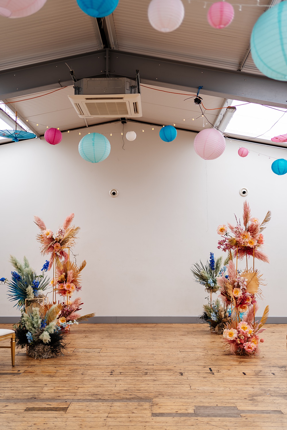 Lea Rowing Club Wedding Marianne Chua Photography Lanterns Lights Ceremony Room Pillar Flowers Dried Pink Palms