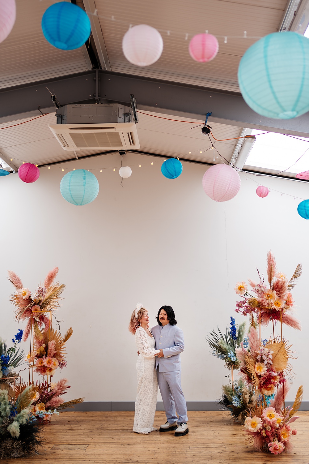 Lea Rowing Club Wedding Marianne Chua Photography Lanterns Lights Ceremony Room Pillar Flowers Dried Pink Palms