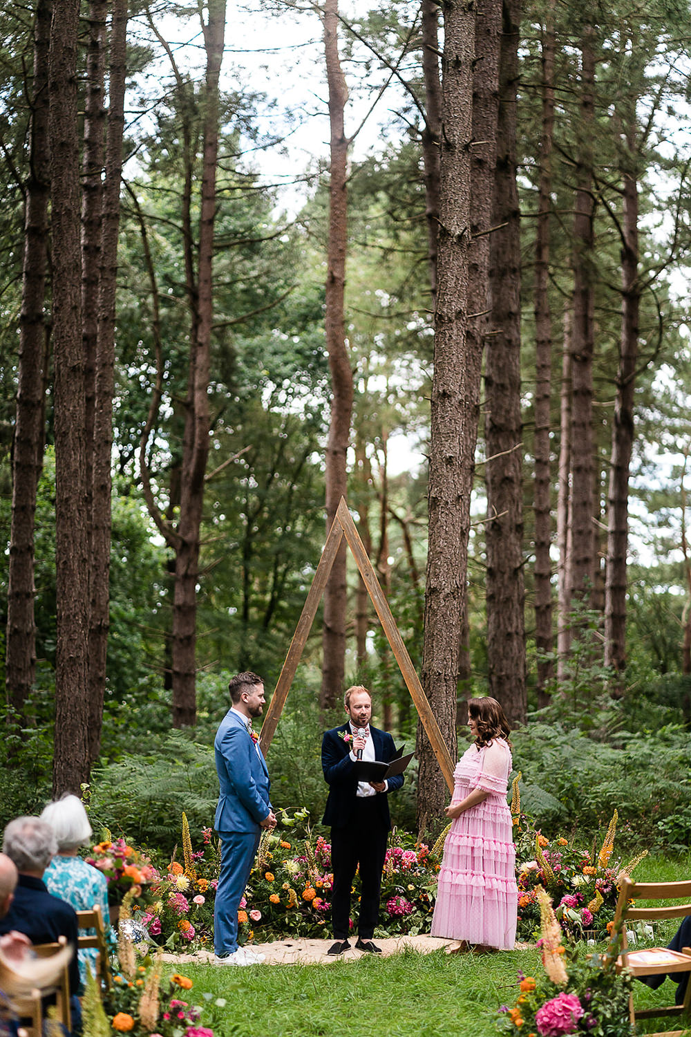 Pink Orange Disco Wedding Lisa and Neil Wedding Photography Woodland Ceremony Triangle Arch Flowers