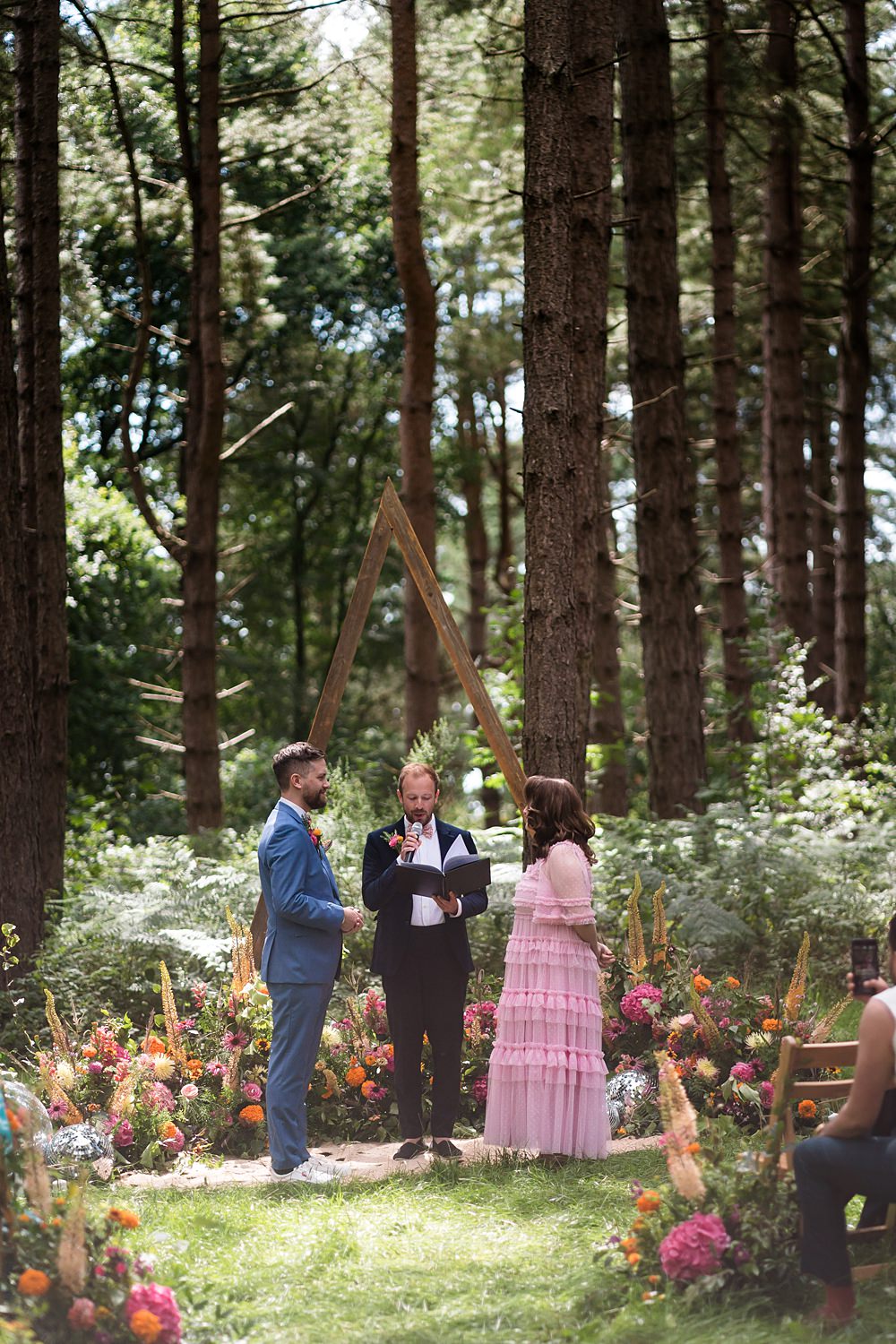 Pink Orange Disco Wedding Lisa and Neil Wedding Photography Woodland Ceremony Triangle Arch Flowers