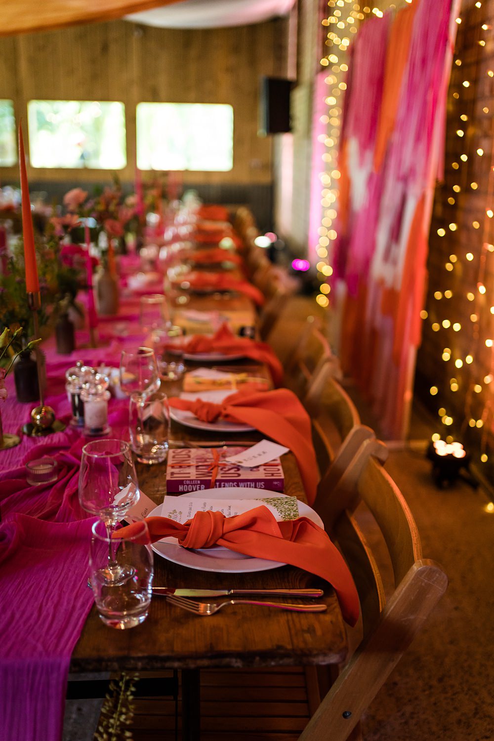 Pink Orange Disco Wedding Lisa and Neil Wedding Photography Long Table Decor Runner Flowers Disco Balls Candles Place Setting Knotted Napkin