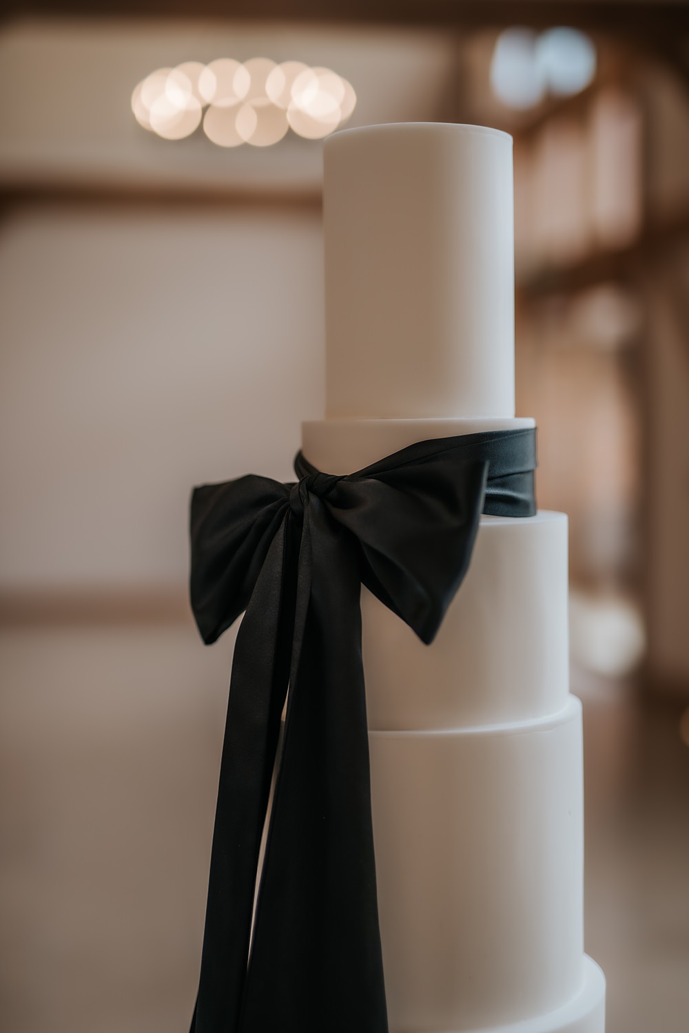 Chic Monochrome Wedding Inspiration Emma Collyer Photography 7 Tier White Cake Black Bow