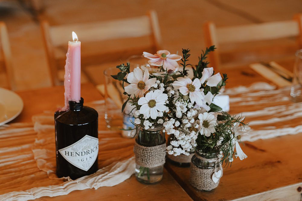 Church Tipi Wedding Charlotte Wotton Photography White Flowers Jars Centrepiece
