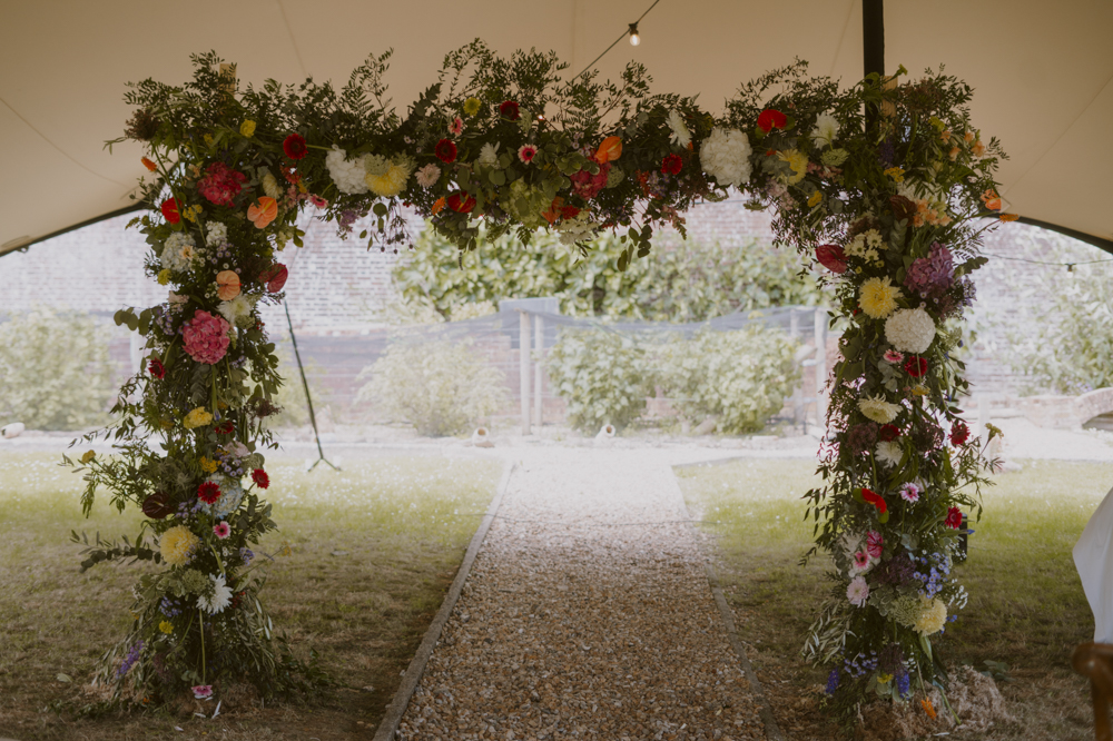 Highden Estate Wedding Sasha Weddings Colourful Flower Arch Ceremony