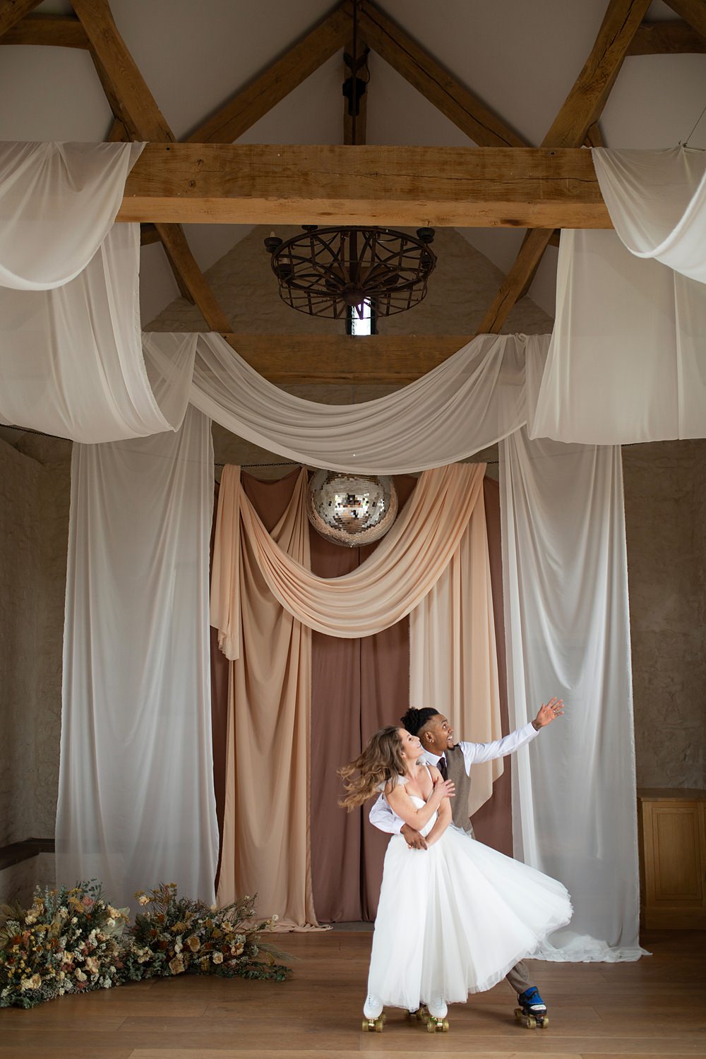 Roller Disco Wedding Ideas Heather Winstanley Photography Barn Drapes Disco Ball Backdrop