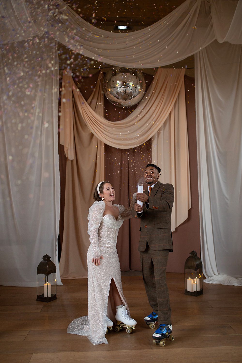 Roller Disco Wedding Ideas Heather Winstanley Photography Barn Drapes Disco Ball Backdrop