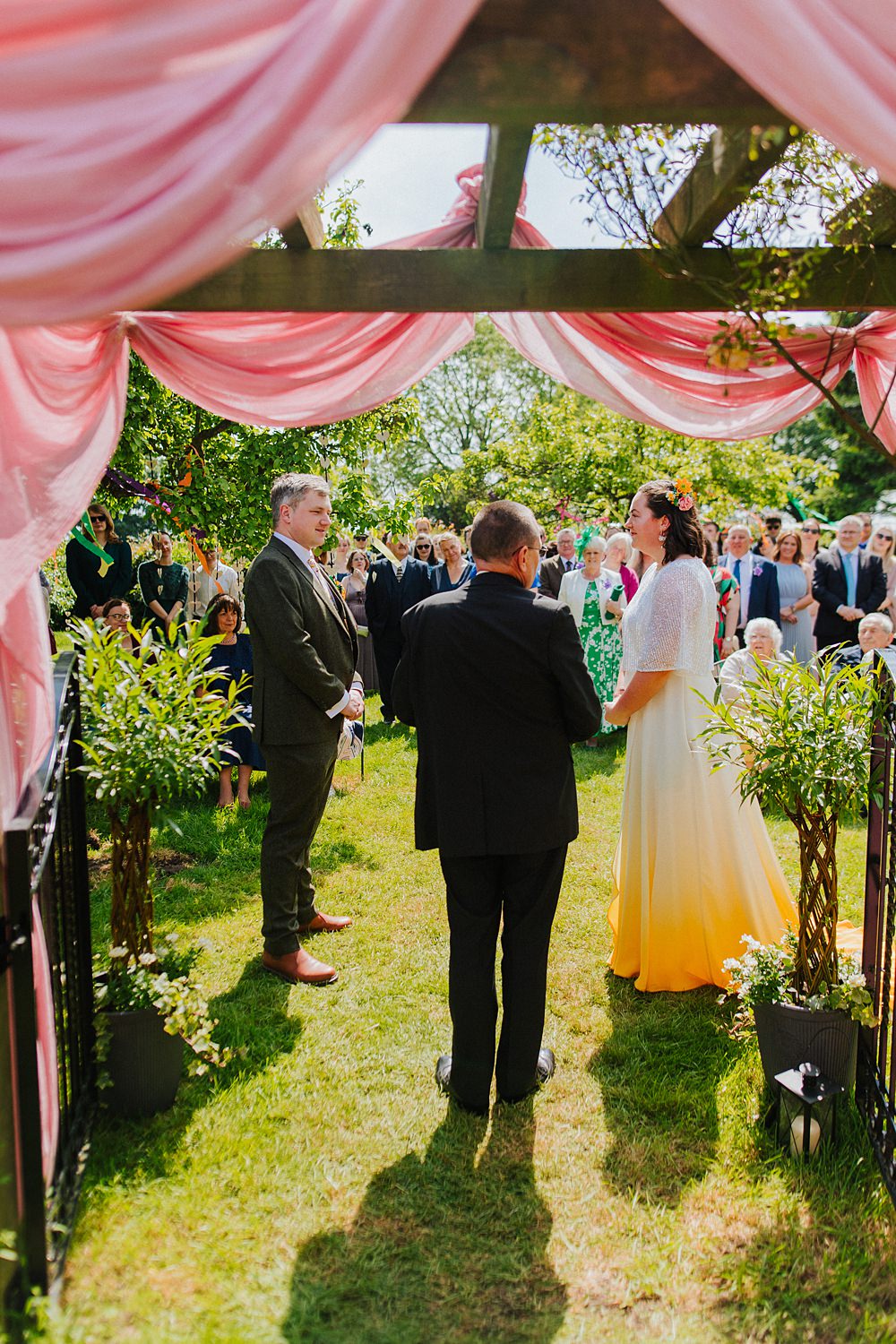 Colourful DIY Tipi Garden Wedding Lily North Photography Pink Fabric Wooden Arch Ceremony