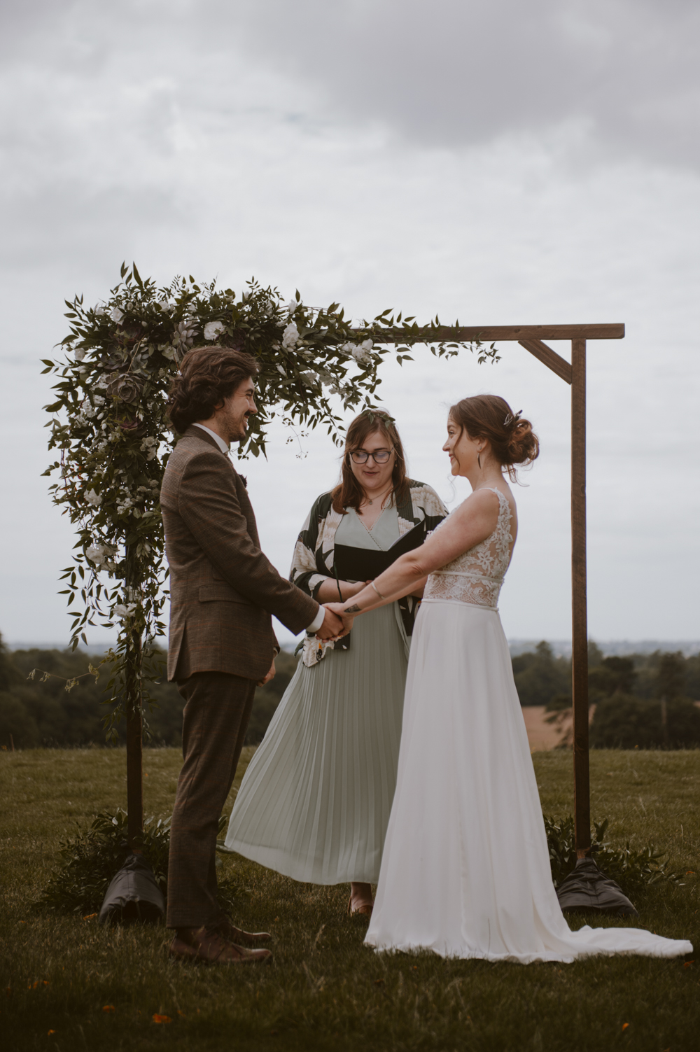 Slindon House Wedding Sasha Weddings Wooden Arch Greenery Foliage Backdrop
