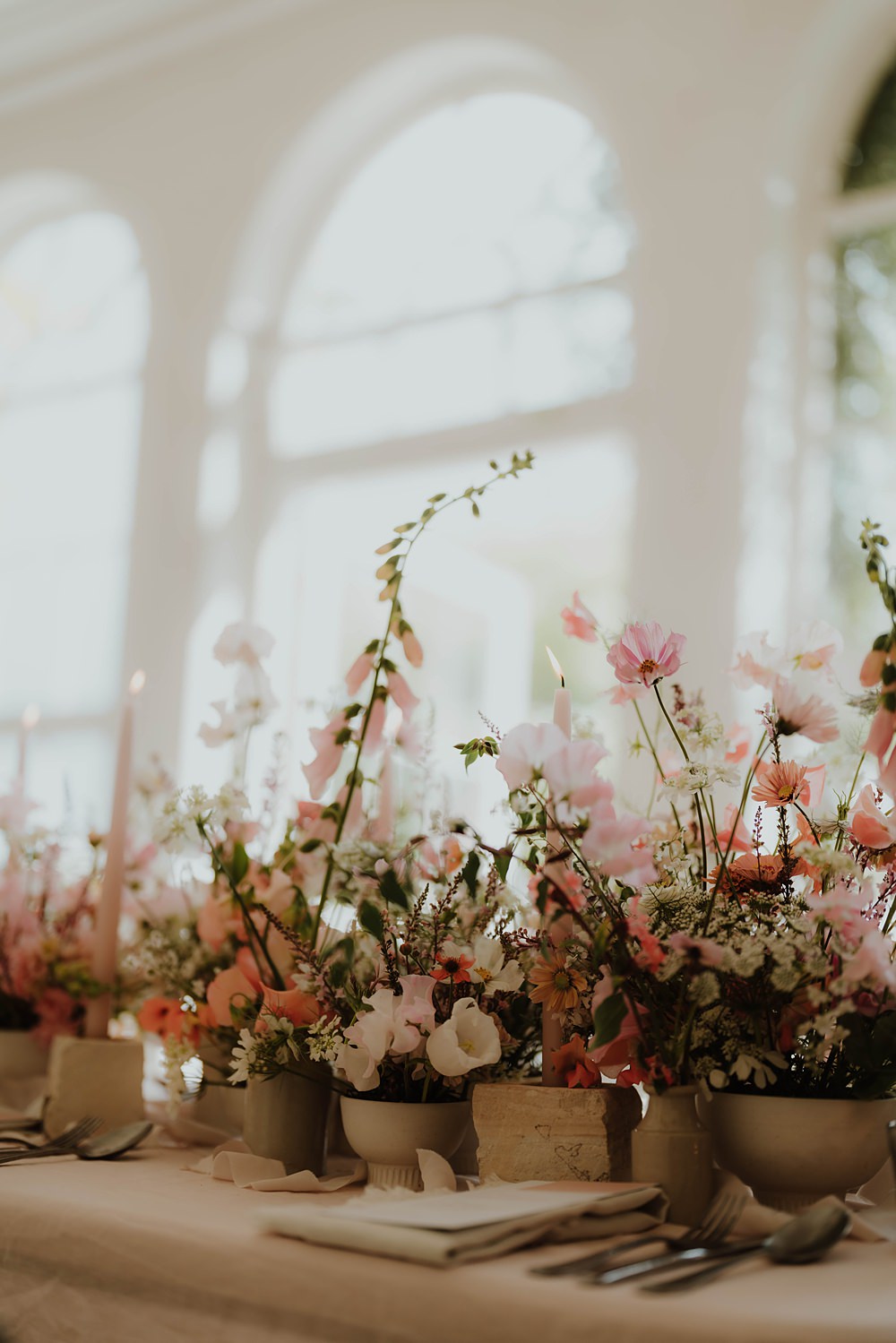 Spring Cotswolds Wedding Ideas Mei Lou Photography Pink Peach Flowers Centrepiece Table Candles