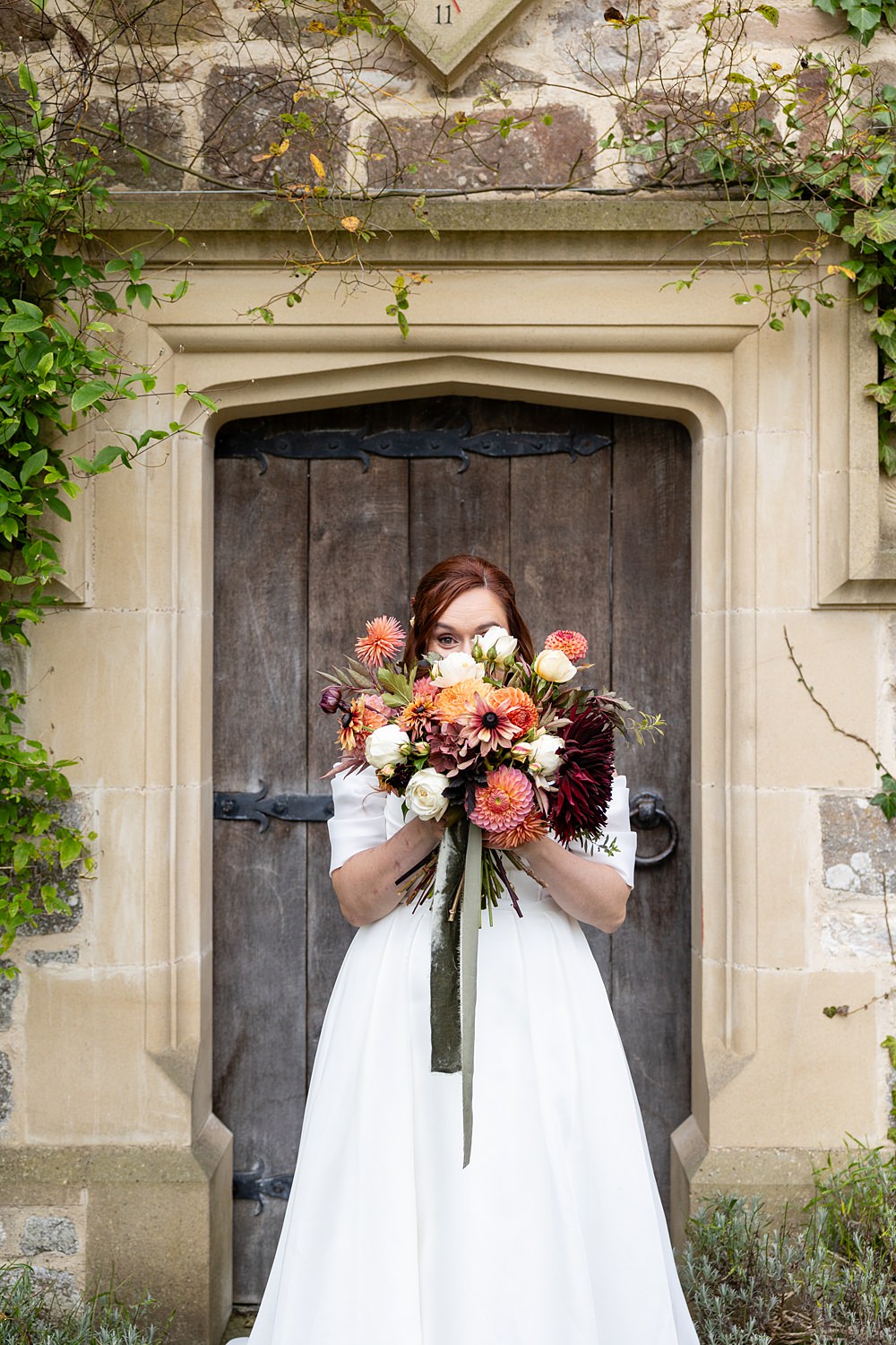 The Courtyard Venue Wedding Ideas Nicki Jones Photography Orange Red Autumn Dahlia Bouquet