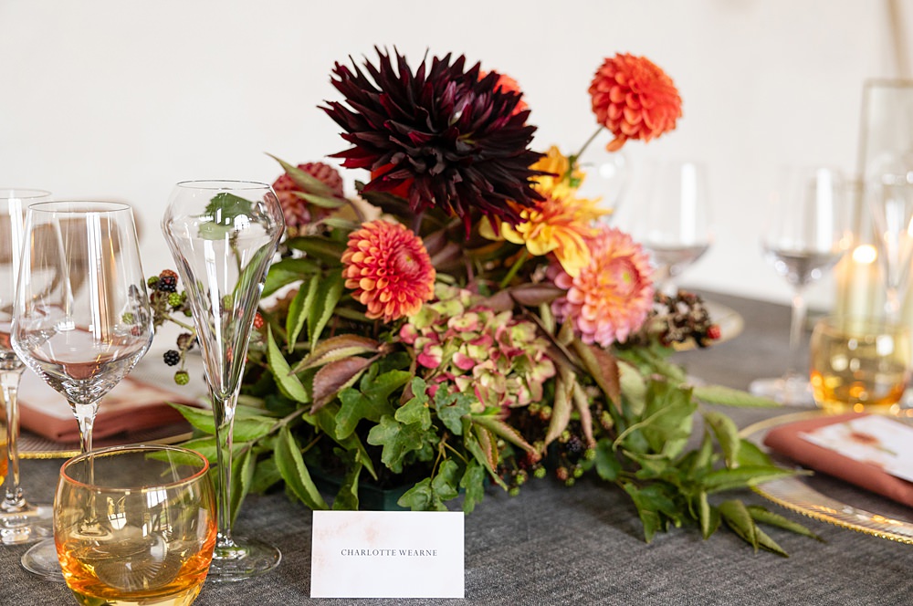 The Courtyard Venue Wedding Ideas Nicki Jones Photography Long Table Grey Cloths Orange Red Candles Flowers Autumn Decor