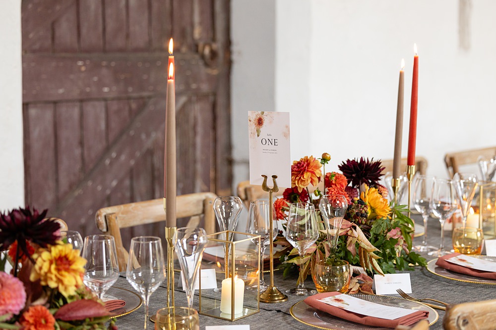 The Courtyard Venue Wedding Ideas Nicki Jones Photography Long Table Grey Cloths Orange Red Candles Flowers Autumn Decor
