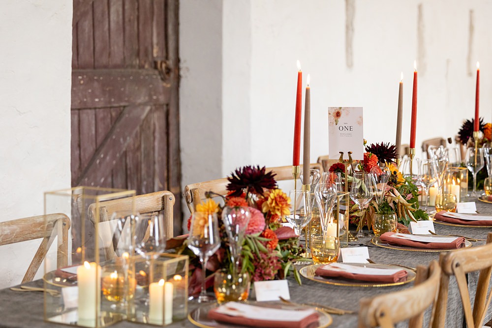 The Courtyard Venue Wedding Ideas Nicki Jones Photography Long Table Grey Cloths Orange Red Candles Flowers Autumn Decor