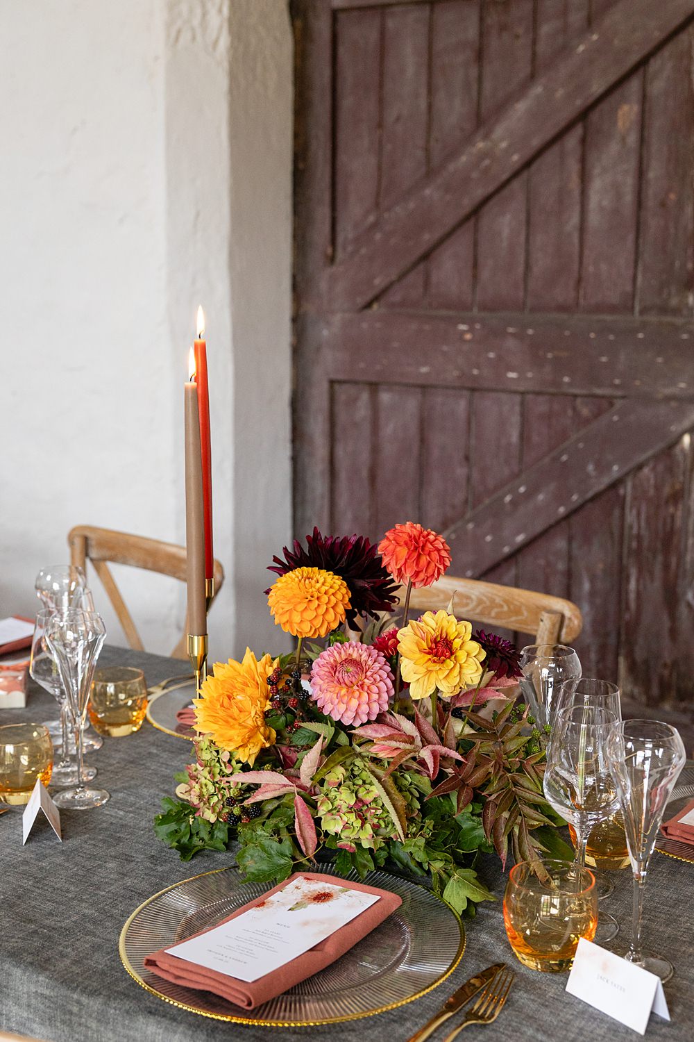 The Courtyard Venue Wedding Ideas Nicki Jones Photography Long Table Grey Cloths Orange Red Candles Flowers Autumn Decor