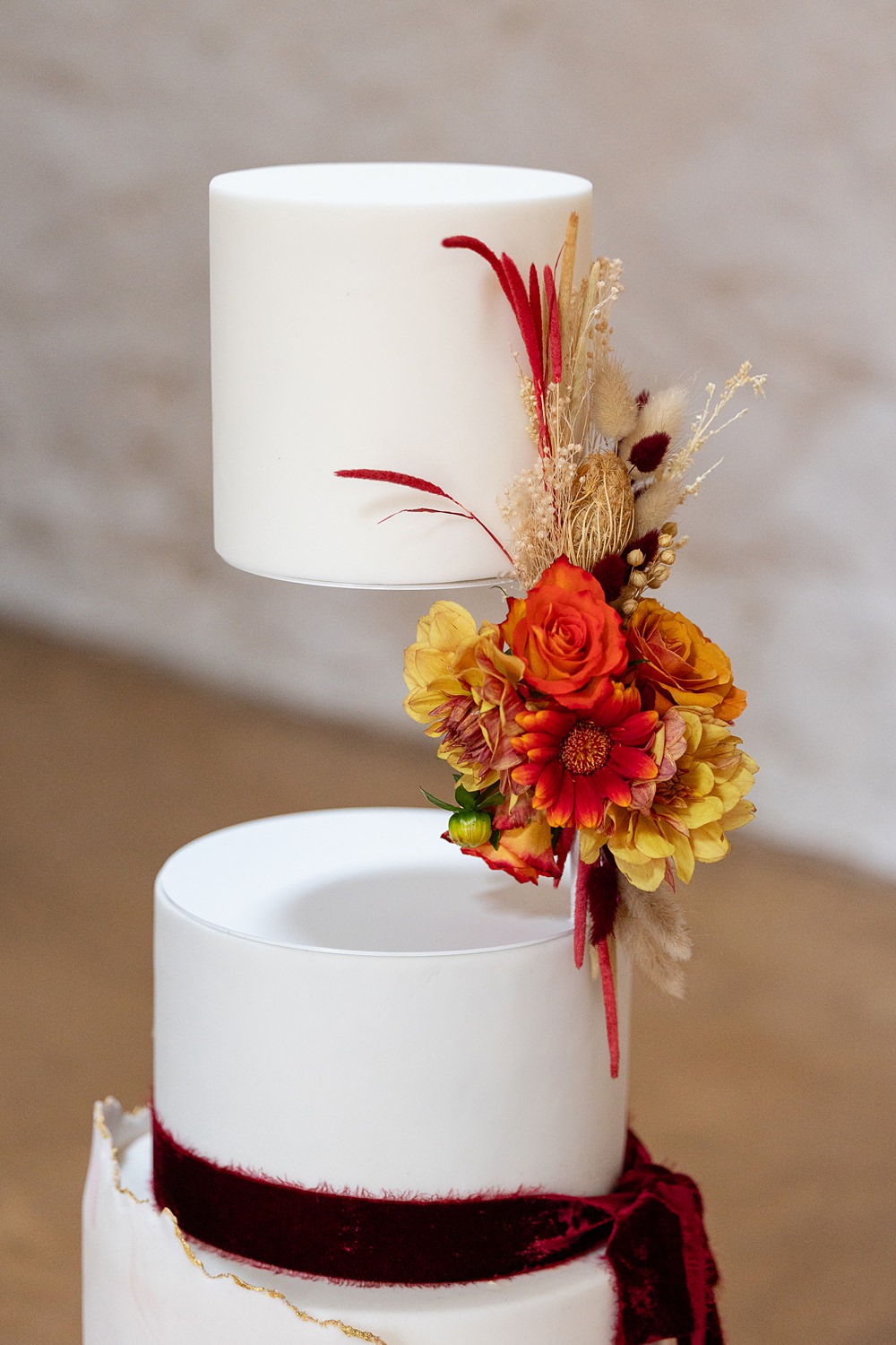 The Courtyard Venue Wedding Ideas Nicki Jones Photography Invisible Tier Cake Red Ribbon Flowers