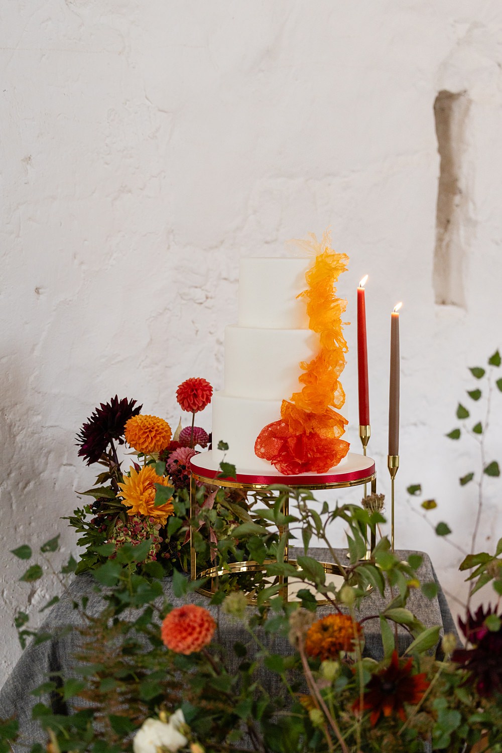 The Courtyard Venue Wedding Ideas Nicki Jones Photography Ombre Cake Red Yellow Orange 3 Tier