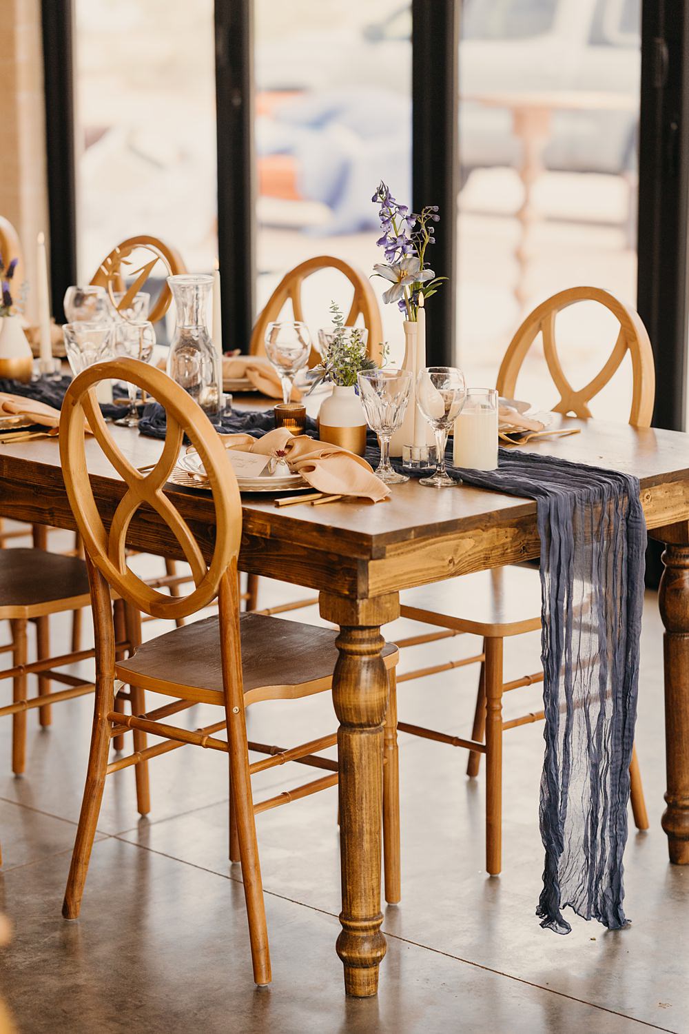 The Red Earth Venue Wedding Adventure and Vow Wooden Rustic Table Blue Runner Orange Flowers Candles