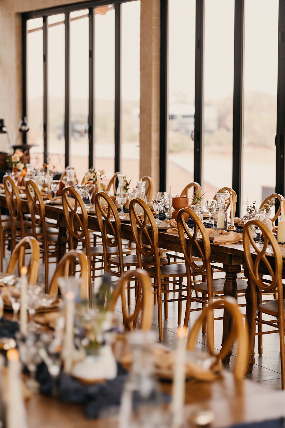 The Red Earth Venue Wedding Adventure and Vow Rustic Table Blue Runner Orange Flowers Candle