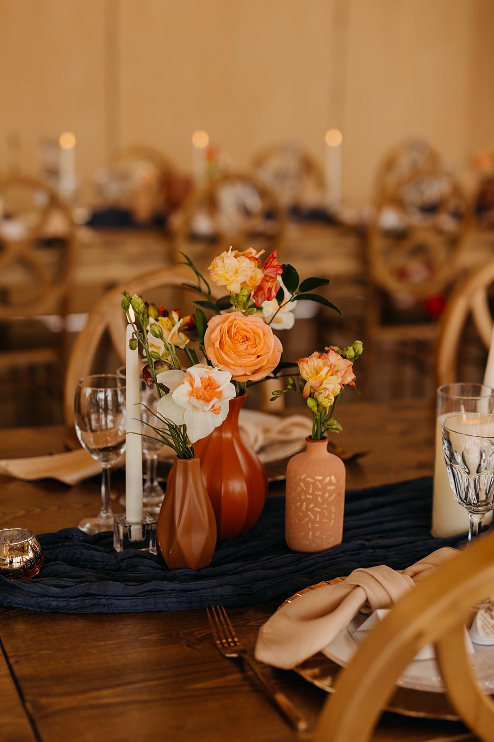 The Red Earth Venue Wedding Adventure and Vow Rustic Table Blue Runner Orange Flowers Candle