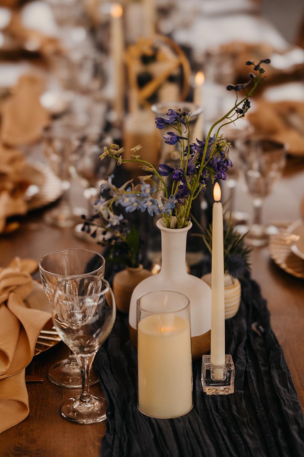 The Red Earth Venue Wedding Adventure and Vow Rustic Table Blue Runner Orange Flowers Candle