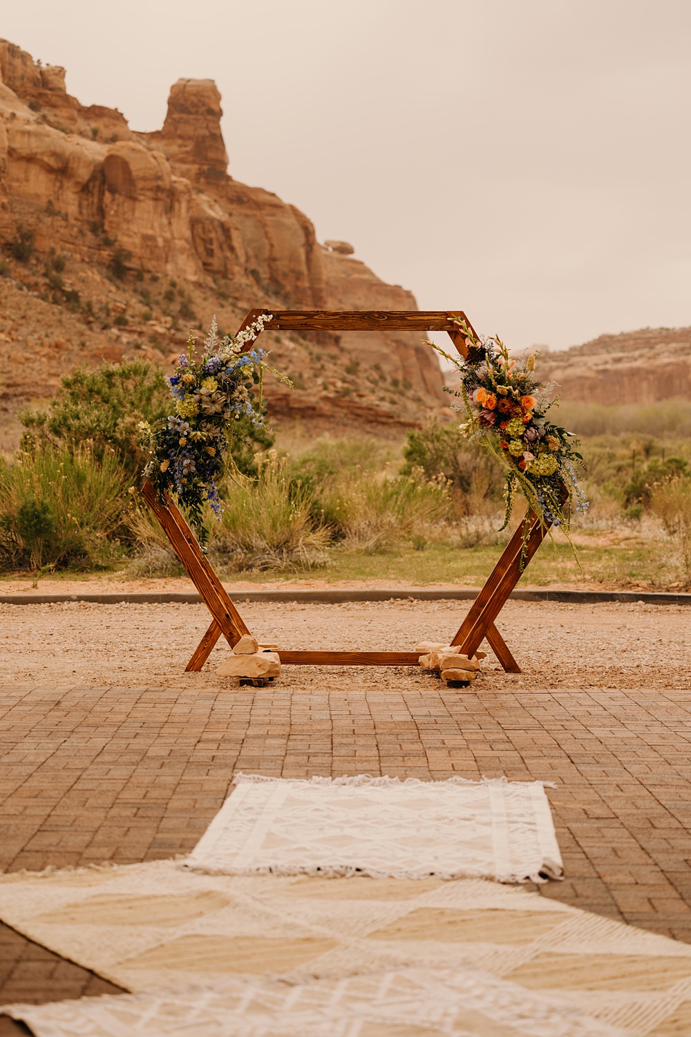 The Red Earth Venue Wedding Adventure and Vow Hexagon Wooden Flower Arch Ceremony