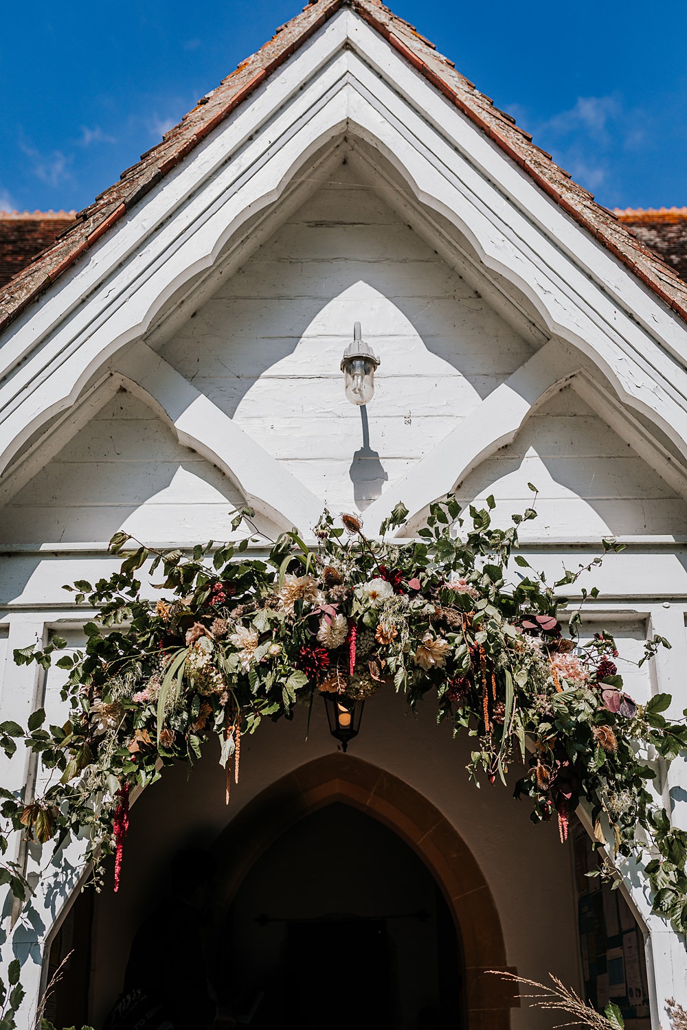 Chidham Barn Wedding Lucy Davis Photography Church Flower Arch Door