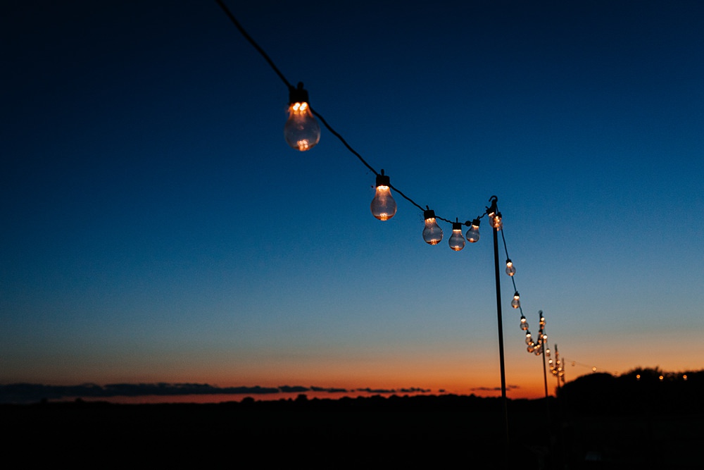 Chidham Barn Wedding Lucy Davis Photography Festoon Lights Sunset