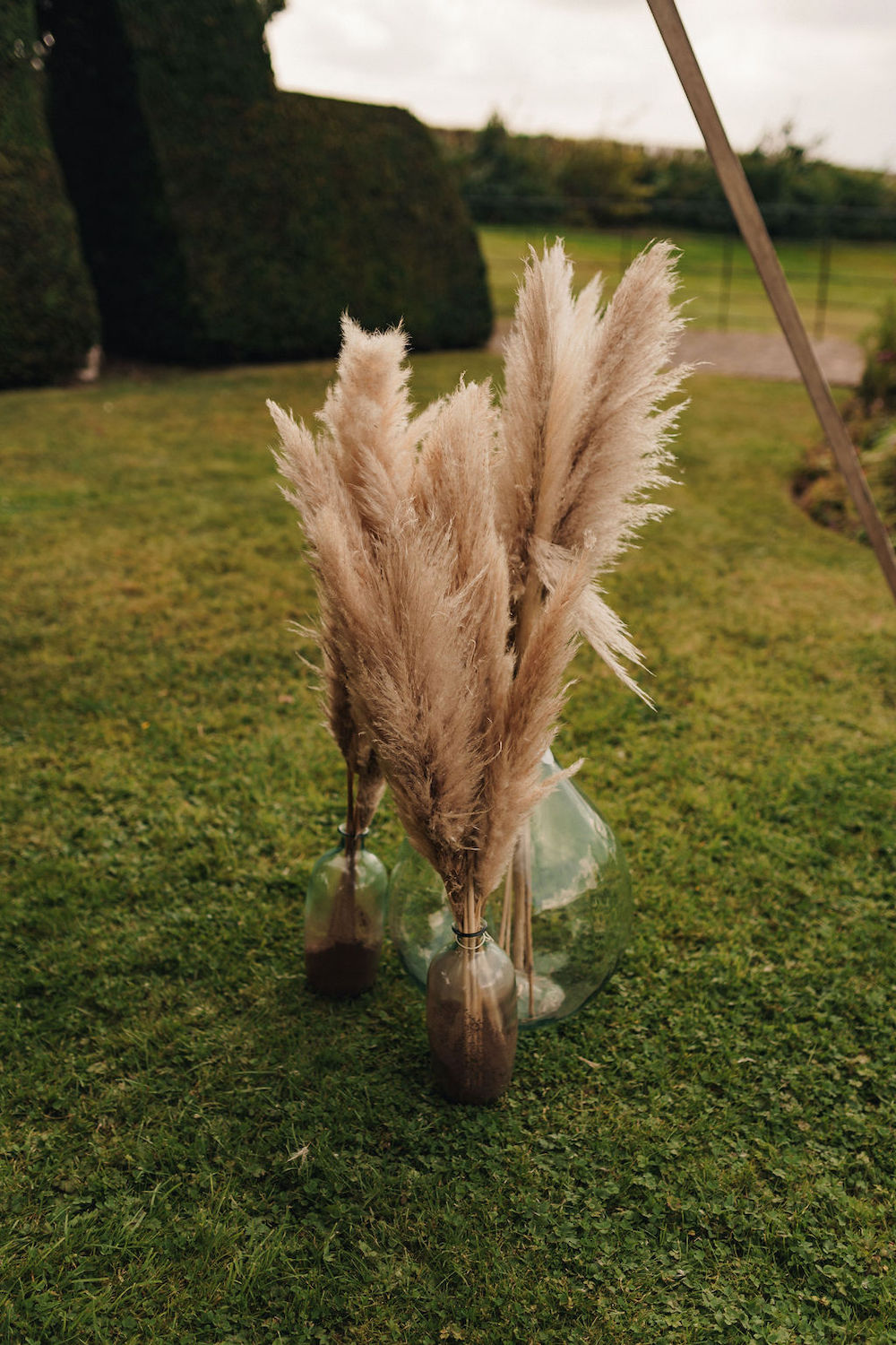 Disco Boho Wedding The Chamberlins Pampas Grass Ceremony Flowers