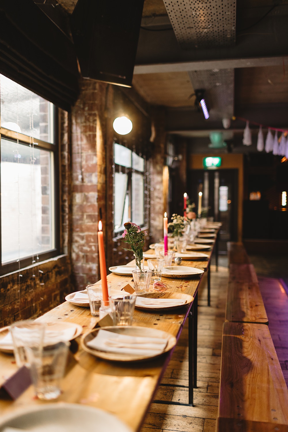 Headrow House Wedding Louise Barry Photographer Long Wooden Tables Colourful Tall Candles