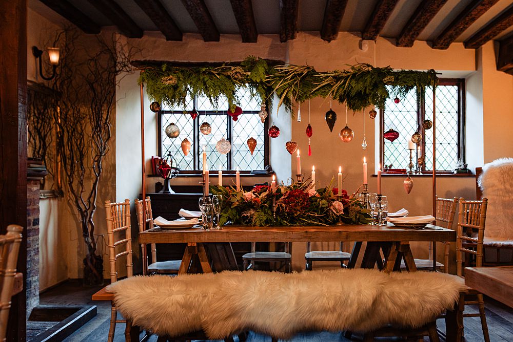 Vintage Winter Wonderland Wedding Ideas Natalia Case Photography Rustic Wooden Table Christmas Greenery Baubles Decor Candles Flowers