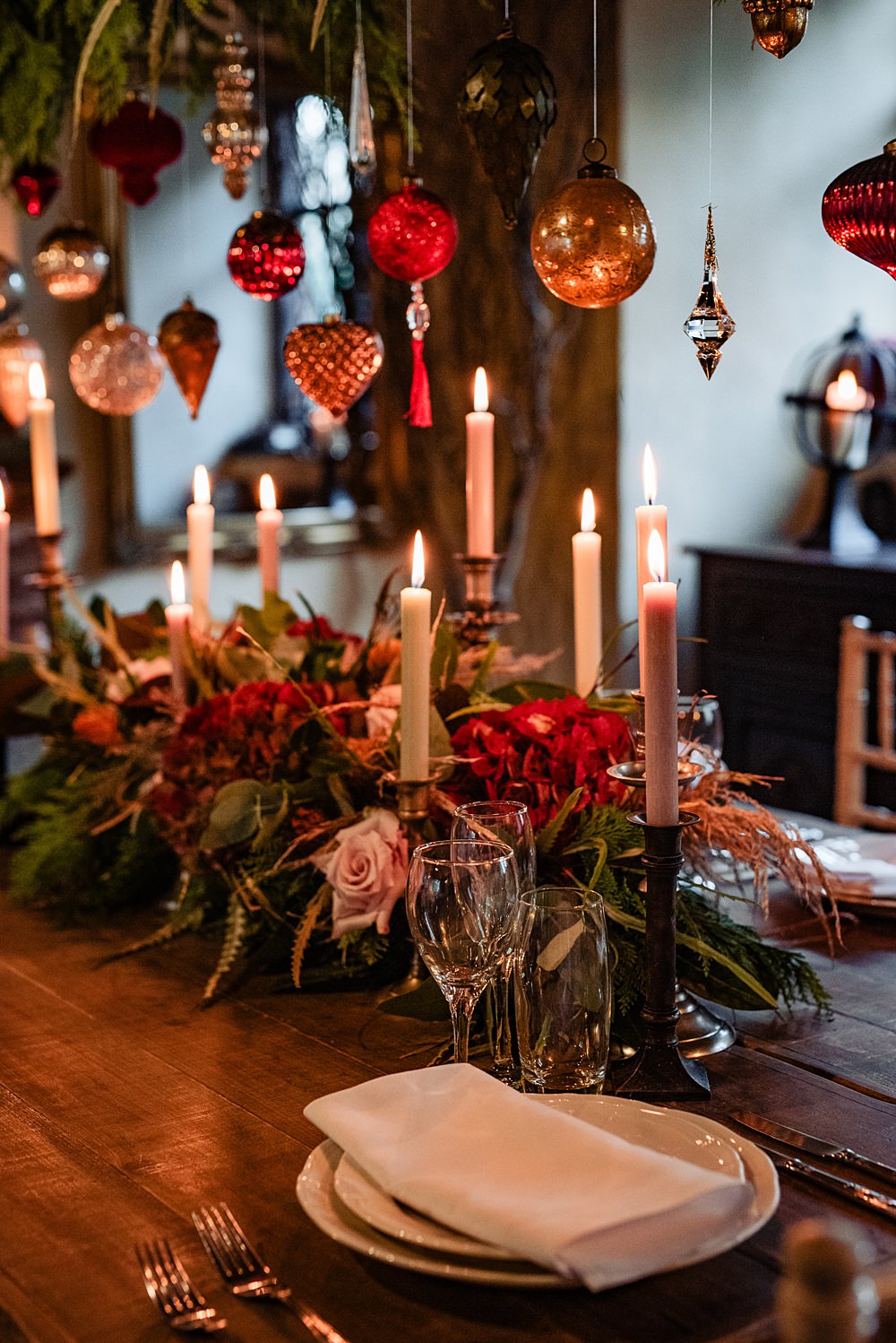 Vintage Winter Wonderland Wedding Ideas Natalia Case Photography Wooden Table Christmas Greenery Baubles Decor Candles Flowers